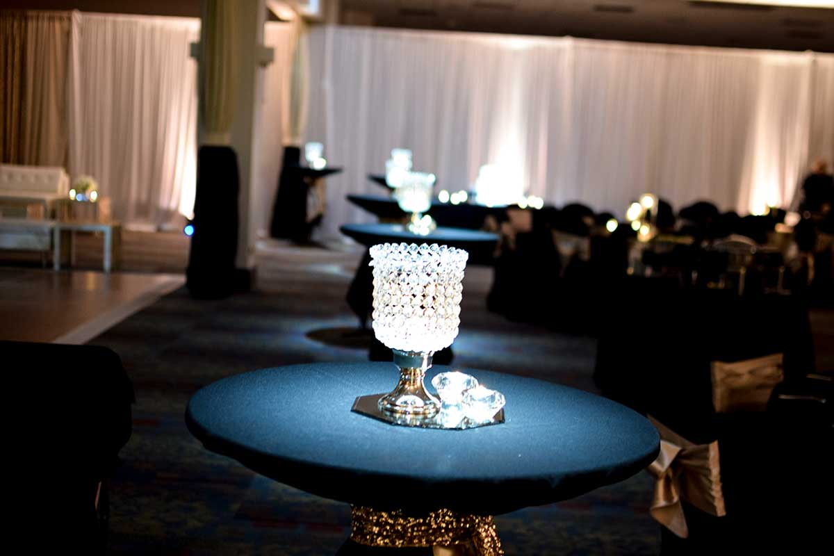 Table pin spot lighting at Des Moines Marriott wedding